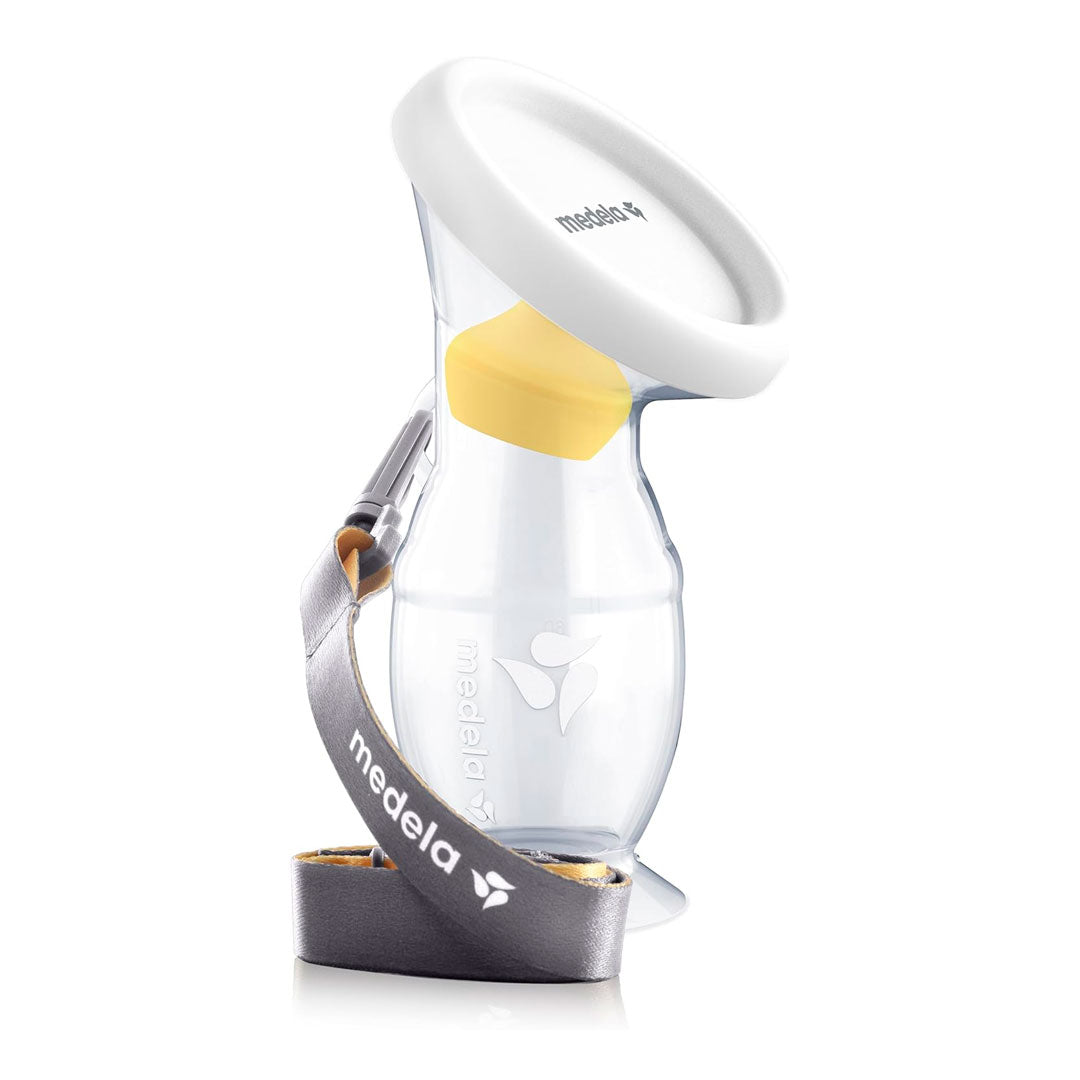 Hakka recolectora en silicona 100% BPA Free, de una capacidad de 100ml / 3.4 oz, con cordón para facilitar su uso, cuenta con tapa y base de sujeción segura - Medela